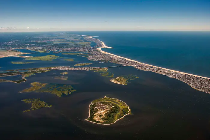 The Rockaway peninsula in Queens, New York from the air separating Jamaica Bay from the Atlantic Ocean